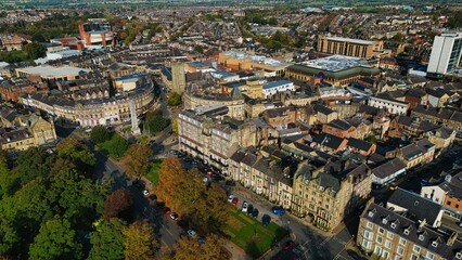 Obraz premium Aerial View of a Vibrant Town with Historic and Modern Architecture