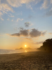 view of the sky before dusk on a quiet beach