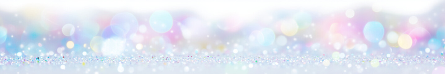 Obraz premium Soft multicolored pastel bokeh lights on a white background