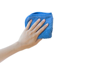 A hand holding a blue microfiber cleaning cloth against a white background. copy space