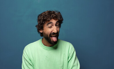 Obraz premium with cheerful, carefree, rebellious attitude, joking and sticking tongue out, having fun