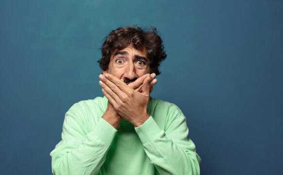 covering mouth with hands with a shocked, surprised expression, keeping a secret or saying oops