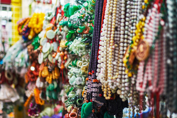 Fototapeta premium Colorful decorations and glass beads on a Hong Kong street market.