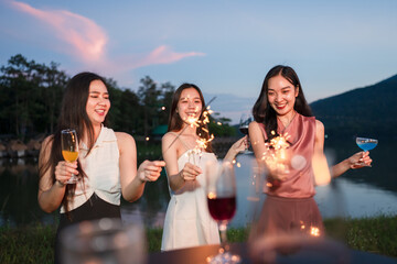 Asian women celebrating, meeting and chatting in a bar. Places to visit, beautiful lights