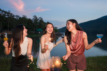 Asian women celebrating, meeting and chatting in a bar. Places to visit, beautiful lights