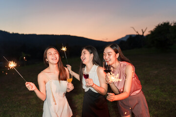 Asian women celebrating, meeting and chatting in a bar. Places to visit, beautiful lights
