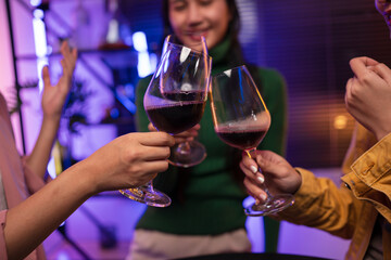 Asian women celebrating, meeting and chatting in a bar. Places to visit, beautiful lights