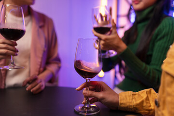 Asian women celebrating, meeting and chatting in a bar. Places to visit, beautiful lights