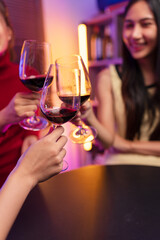 Asian women celebrating, meeting and chatting in a bar. Places to visit, beautiful lights