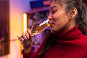 Asian women celebrating, meeting and chatting in a bar. Places to visit, beautiful lights