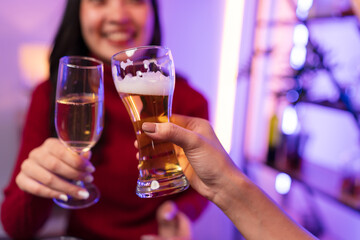 Asian women celebrating, meeting and chatting in a bar. Places to visit, beautiful lights