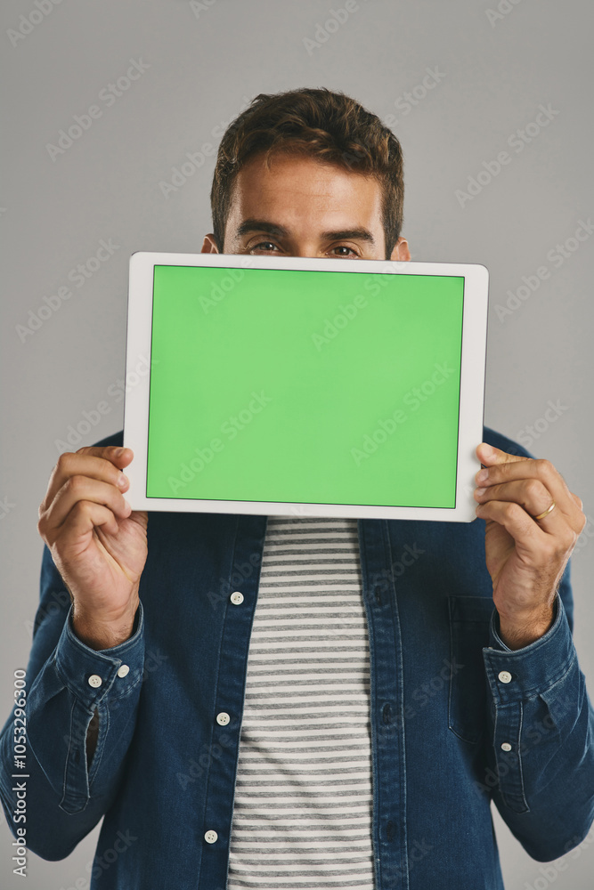 Poster eyes, green screen and tablet with man in studio isolated on gray background for app download or upd
