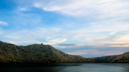 Fototapeta premium Lakes with hills with blue sky and clouds in the background