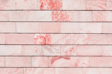 Pastel light red marble brick wall background. Horizontally.