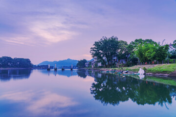 Obraz premium The mountains, Oujiang River, and fishing boats in Lishui City, Zhejiang Province, China 