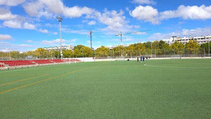 Bright and Open Football Field on a Clear Day