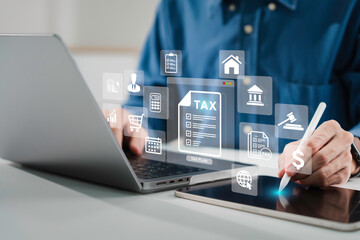 Businessman using a computer to Tax planning 2025, Calculation and complete Individual income tax...