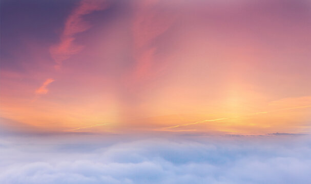 Pastle clouds in the sky at sunrise over .Exotic sunset and soft pink clouds of pastel tones. Scenic image of textured sky. Perfect summertime wallpaper. Bright epic sky. Dramatic evening light
