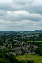 Panoramic view of a town amidst rolling hills