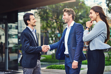 Business, people and happy with handshake outside with welcome, greeting and introduction. Woman,...