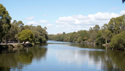 Fototapeta premium Tranquil River Scenery with Clear Blue Sky