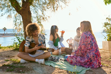 Group of friends having fun on the beach 