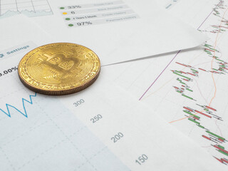 Bitcoin on the charts of exchange trades showing the growth and fall of the crypto currency and virtual money background