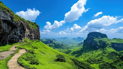 Obraz premium Lush Green Valley Under Clear Blue Sky
