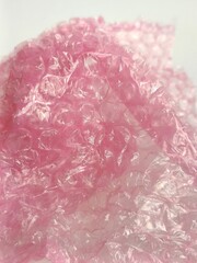 Bubble wrap close-up background photo. It is a pliable plastic material with bubbles of air used for packing fragile items.