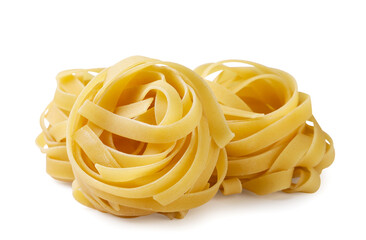 Pile of pasta fettuccine nests close-up on white background. Isolated