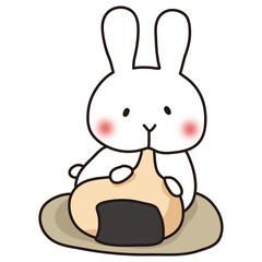 大きなお餅を食べている白いうさぎ1