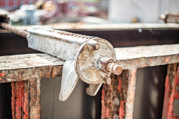 A close-up view of a reinforced concrete foundation under construction at a building site during...