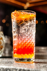 Exquisite fresh and spicy cocktail with vibrant colors and a touch of spice, refreshing cocktail in a luxurious bar.