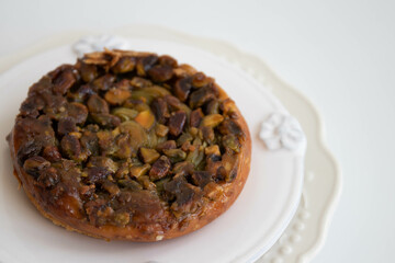Close up Pistachio Kouign Amann, sweet Breton cake , French Pastry