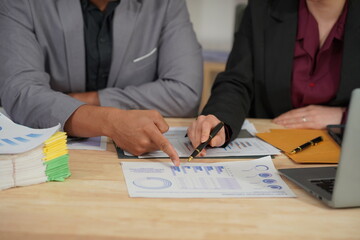 Document work and hands on table in business presentation or seminar Financial advisors present portfolio reports to clients. Focusing on financial advisory services Close-up pictures