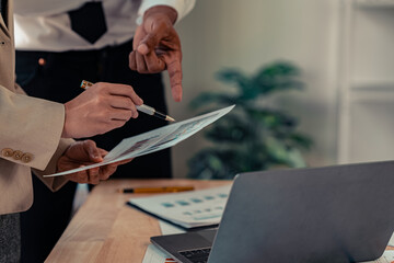 Document work and hands on table in business presentation or seminar Financial advisors present portfolio reports to clients. Focusing on financial advisory services Close-up pictures