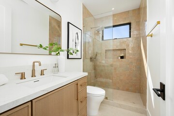 Modern bathroom with glass shower and minimalist decor.