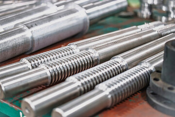 Metal blanks and products arranged neatly in an industrial workshop showcasing precision manufacturing and craftsmanship
