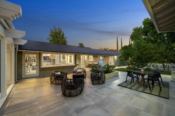Modern outdoor patio with evening lighting.