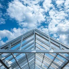 Steel roof structure for building construction. Metal roof structure of a building under construction on a blue sky background with white clouds. Selective focus