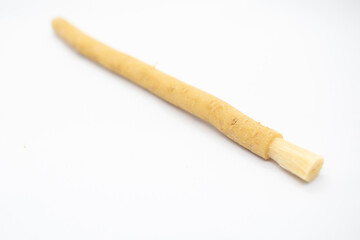 old traditional islamic natural toothbrush miswak or siwak, on white background