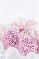 Merry Christmas. Christmas banner in pink color on a white Christmas background. Christmas background, pink xmas holiday card. Christmas card pink balls