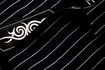 Close up of dark Men's shirt. Soft focus. Copy space.	
