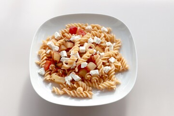 pasta with cheese and tomato sauce as lunch dish