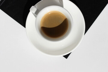 Top View of Espresso Coffee on Black Notebook. Coffee Break.