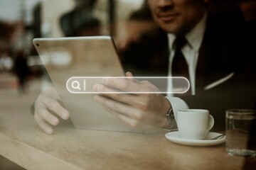 Businessman in a cafe using a tablet