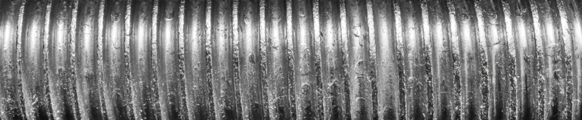 Texture of metal bolt thread. Abstract banner.