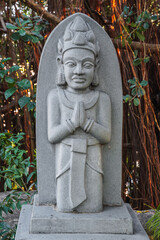 Fototapeta premium Buddhist statue of the deity in the park at pagoda at the Cham Towers in Nha Trang in Vietnam