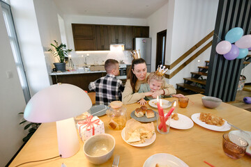 Family having a birthday party at home