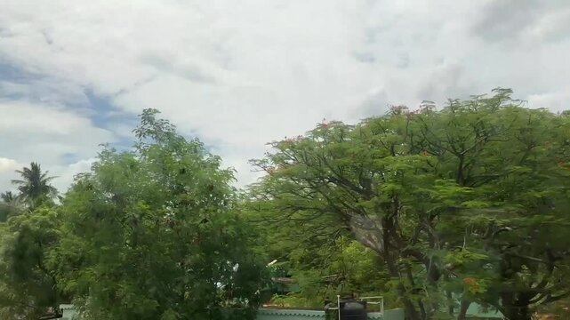 4k video clip of architecture, nature and farming fields view from the running train window.